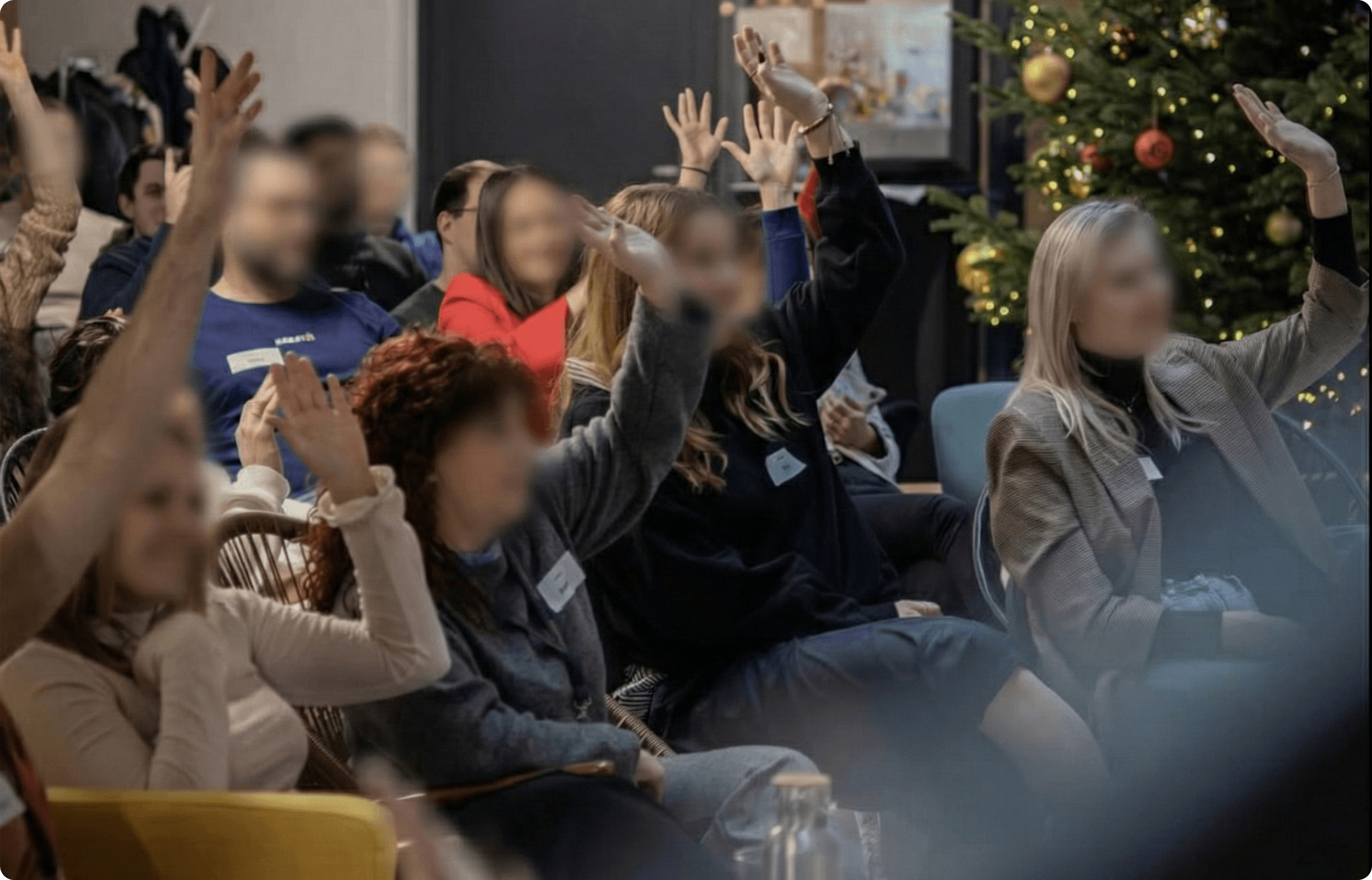 The audience at the company Christmas party during the AI chat presentation